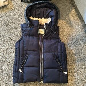 Navy vest hoodie with knit material back. Brand new never worn